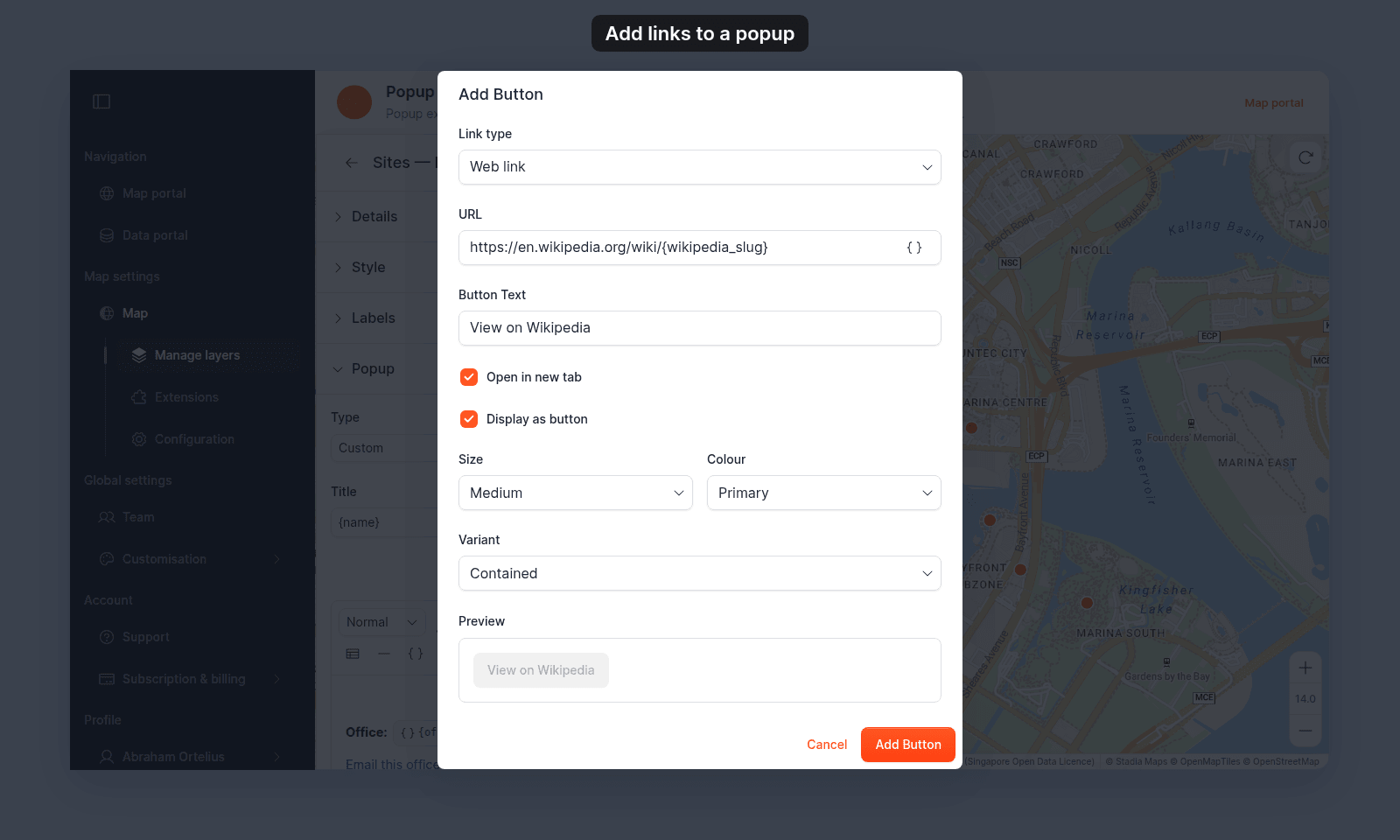 Add Button dialog with Link type set to Web link, https://en.wikipedia.org/wiki/{wikipedia_slug} in URL, View on Wikipedia in Button Text, Open in new tab and Display as button ticked, Size Medium, Colour Primary, Variant Contained, and a preview of the button
