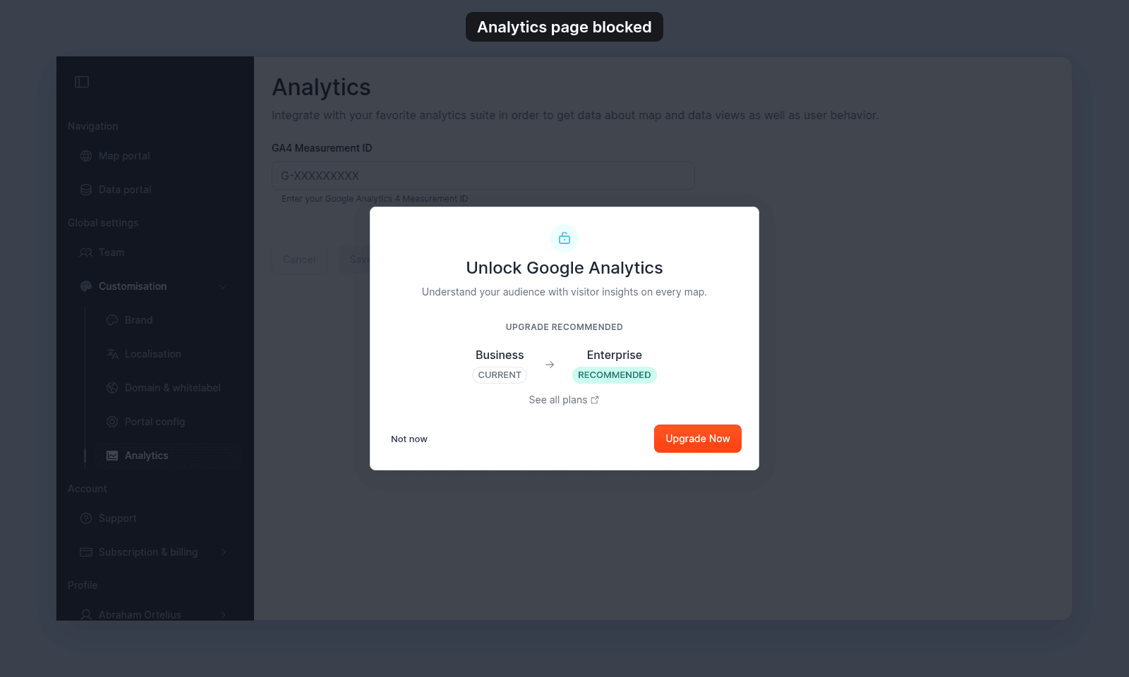 Unlock Google Analytics prompt over the greyed-out Analytics page, with Business marked Current, Enterprise marked Recommended, See all plans, Not now, and Upgrade Now